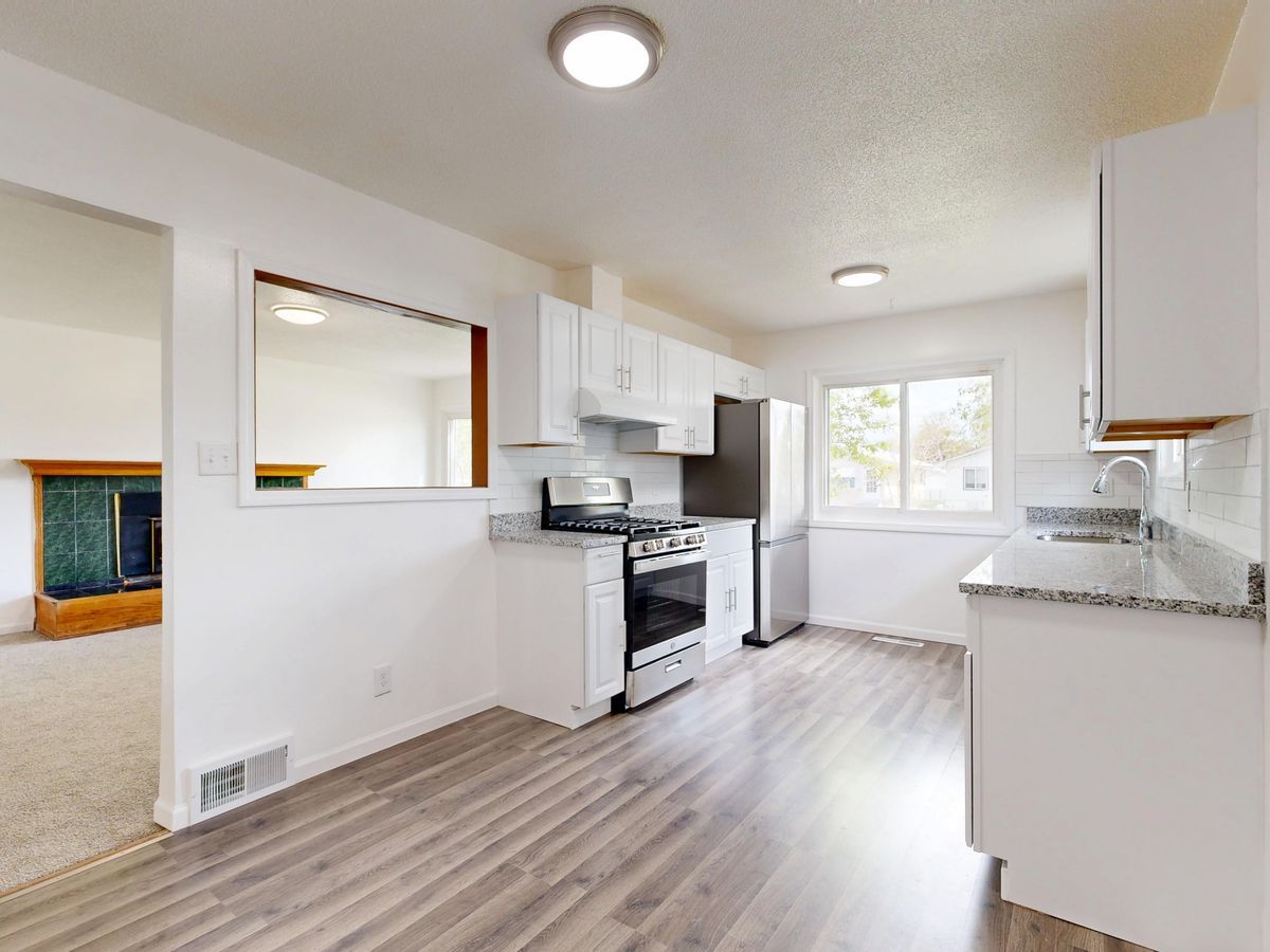 Kitchen with laminate plank floor