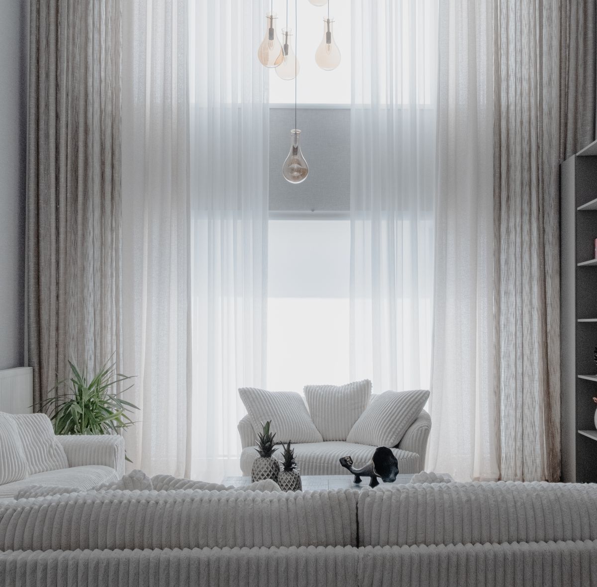 Bright, clean living room with a white sofa